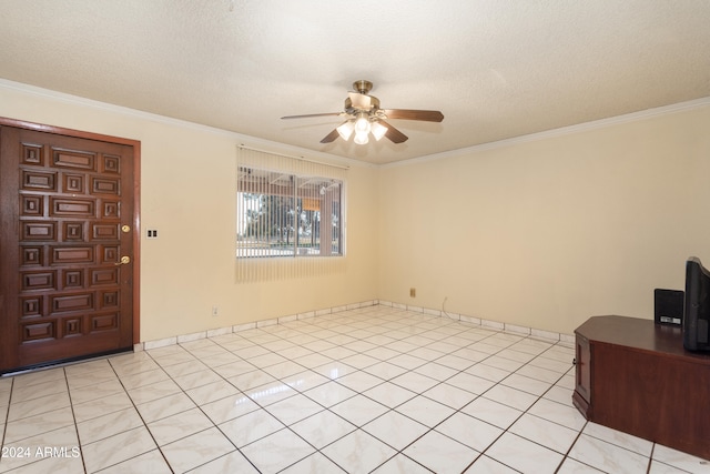 foyer featuring ceiling fan, light tile patterned floors, a textured ceiling, and ornamental molding