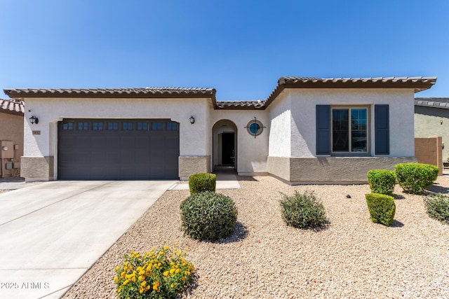 3832 W Mcneil St, Laveen, AZ 85339 - mediterranean / spanish-style house with stucco siding, driveway, a garage, and a tiled roof