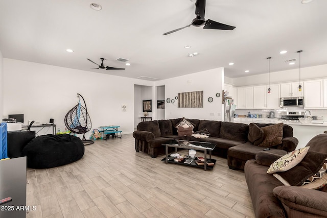 3832 W Mcneil St, Laveen, AZ 85339 - living room featuring ceiling fan, light wood finished floors, and recessed lighting