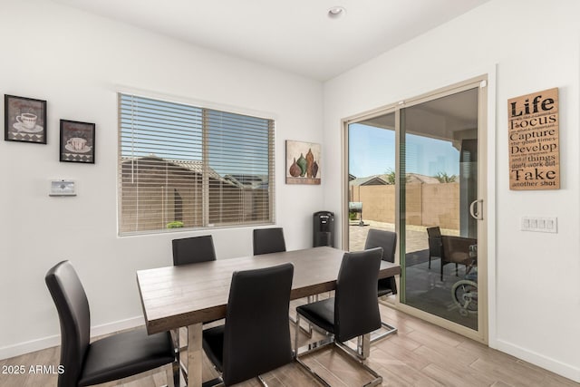 3832 W Mcneil St, Laveen, AZ 85339 - dining area with baseboards and light wood-style floors