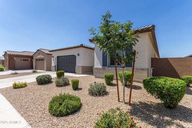 3832 W Mcneil St, Laveen, AZ 85339 - mediterranean / spanish home featuring stucco siding, a garage, a tile roof, and driveway