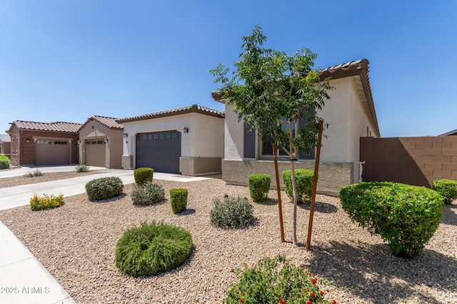 3832 W Mcneil St, Laveen, AZ 85339 - mediterranean / spanish-style house featuring stucco siding, a garage, and a tiled roof