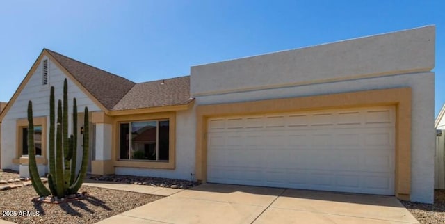 view of front of home featuring an attached garage, stucco siding, driveway, and roof with shingles