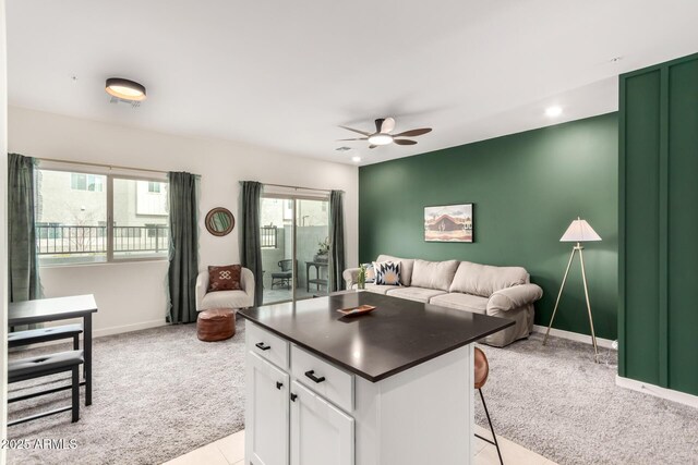 2256 W Laurie Ln, Phoenix, AZ 85021 - living area with light carpet, a ceiling fan, baseboards, light tile patterned floors, and recessed lighting