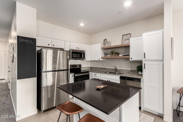 2256 W Laurie Ln, Phoenix, AZ 85021 - kitchen with stainless steel appliances, a sink, open shelves, white cabinets, and recessed lighting