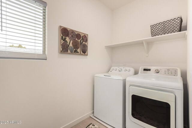 2256 W Laurie Ln, Phoenix, AZ 85021 - laundry room with washer and clothes dryer, light tile patterned floors, and baseboards