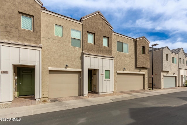 2256 W Laurie Ln, Phoenix, AZ 85021 - view of front facade featuring board and batten siding and a garage