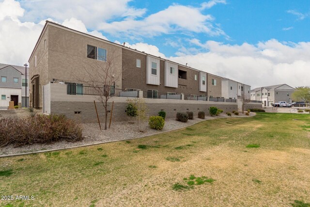 2256 W Laurie Ln, Phoenix, AZ 85021 - rear view of property with a residential view, a yard, and stucco siding