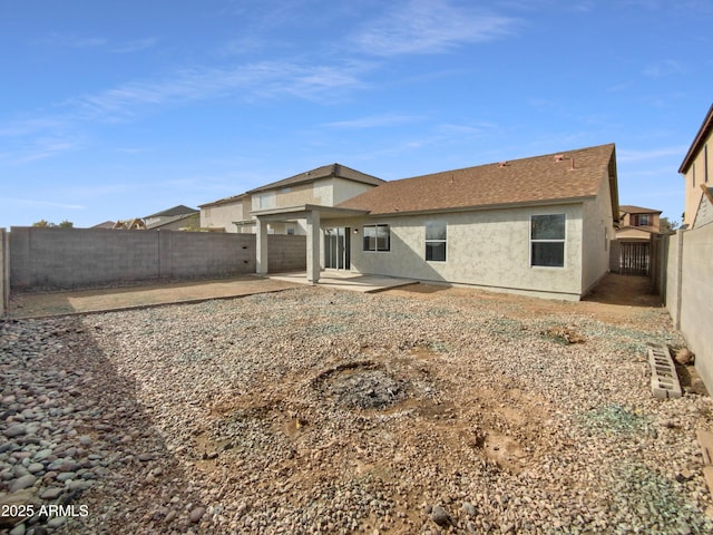 back of house with a patio area