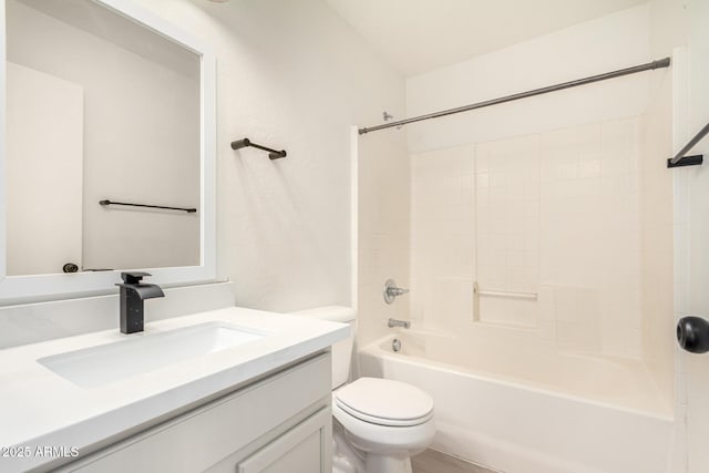 bathroom with shower / bath combination, vanity, and toilet