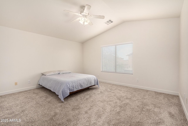 carpeted bedroom with lofted ceiling, visible vents, and baseboards