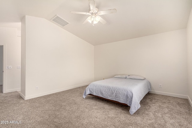 bedroom featuring lofted ceiling, visible vents, and light colored carpet