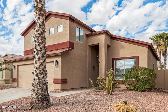 view of front of house featuring an attached garage and stucco siding