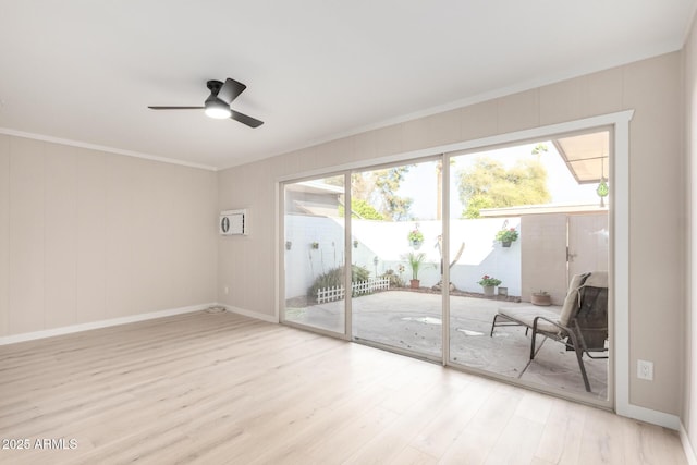interior space featuring ceiling fan, baseboards, ornamental molding, and light wood-style flooring