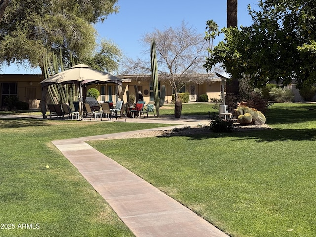 surrounding community featuring a patio area and a yard