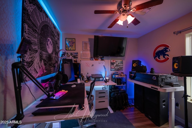 game room with wood-type flooring and ceiling fan