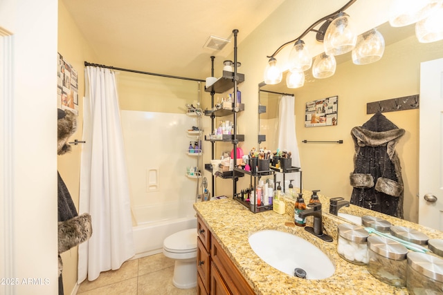 full bathroom featuring tile patterned flooring, vanity, toilet, and shower / bath combo