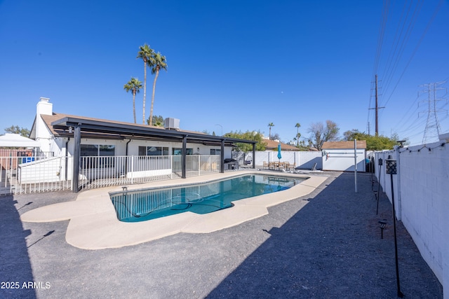 view of swimming pool featuring central AC unit and a patio area