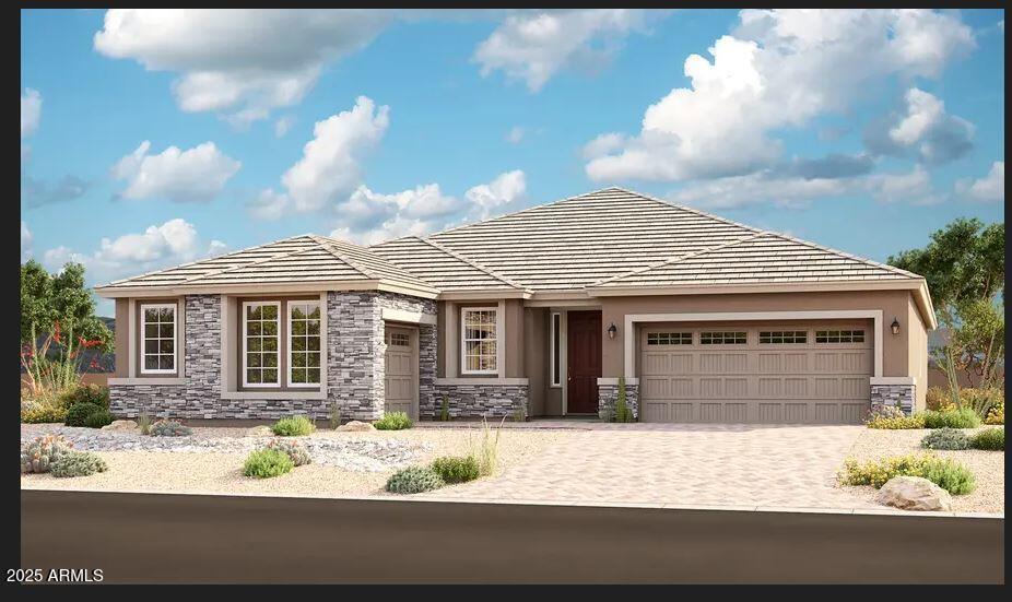 view of front of house with a garage, stone siding, stucco siding, and decorative driveway