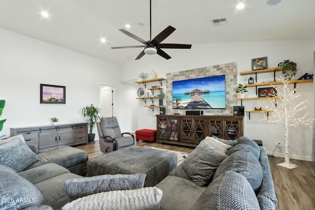 living room featuring ceiling fan, wood-type flooring, and high vaulted ceiling