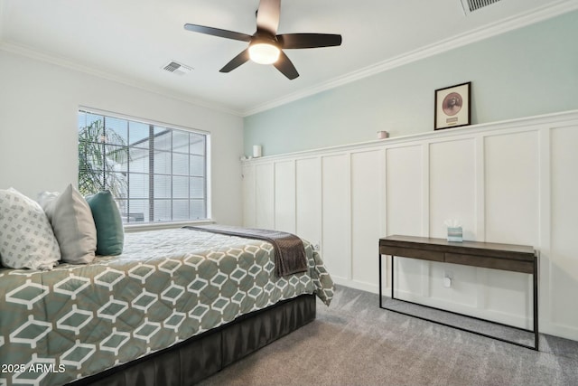 bedroom featuring crown molding, light colored carpet, and ceiling fan