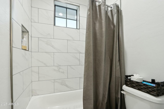 bathroom with shower / bathtub combination with curtain and toilet