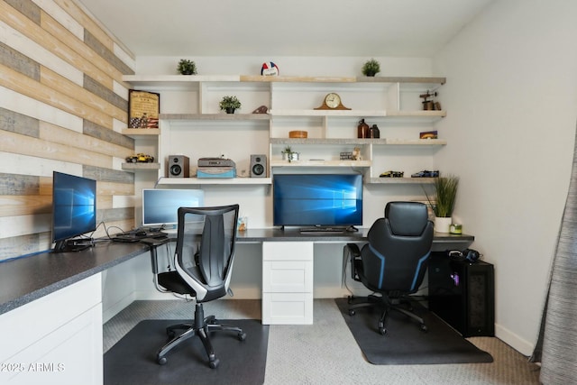 office with light carpet and built in desk