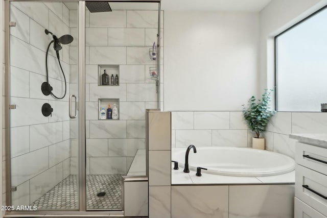 bathroom featuring vanity and separate shower and tub