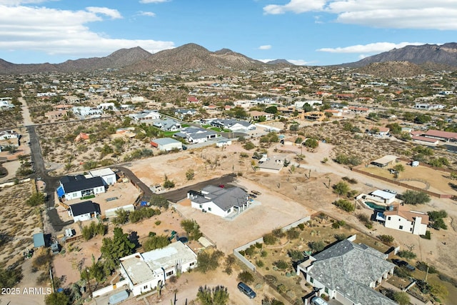 birds eye view of property with a mountain view