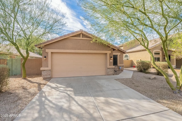 ranch-style house with driveway, stone siding, a garage, and stucco siding