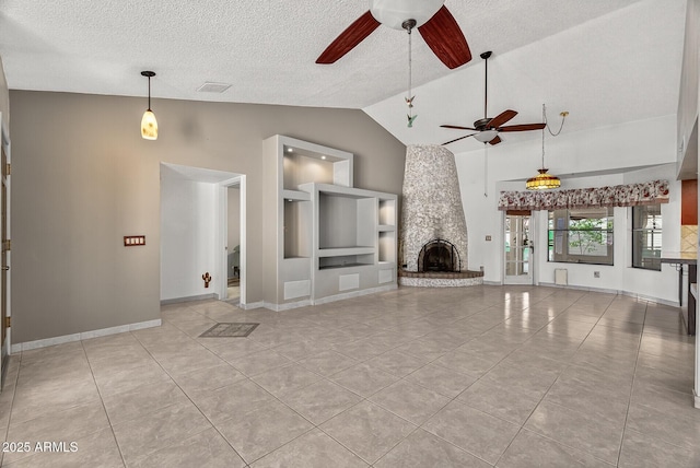 9839 W Utopia Rd, Peoria, AZ 85382 - unfurnished living room featuring ceiling fan, light tile patterned floors, a stone fireplace, a textured ceiling, and built in features