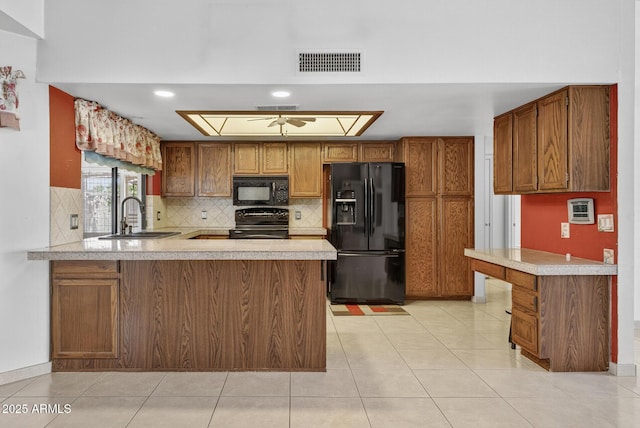 9839 W Utopia Rd, Peoria, AZ 85382 - kitchen featuring black appliances, a peninsula, light countertops, decorative backsplash, and recessed lighting