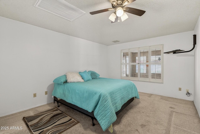 9839 W Utopia Rd, Peoria, AZ 85382 - carpeted bedroom with attic access, a ceiling fan, and a textured ceiling