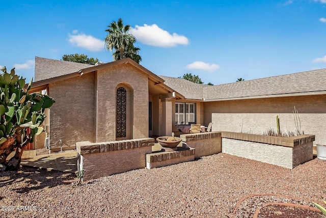 9839 W Utopia Rd, Peoria, AZ 85382 - view of front of home featuring stucco siding and roof with shingles