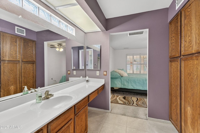 9839 W Utopia Rd, Peoria, AZ 85382 - bathroom with vanity, tile patterned floors, ceiling fan, and connected bathroom