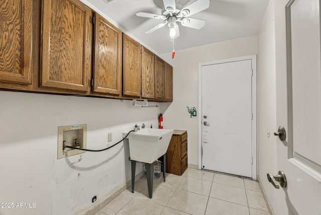 9839 W Utopia Rd, Peoria, AZ 85382 - laundry room with cabinet space, hookup for a washing machine, light tile patterned flooring, and a ceiling fan
