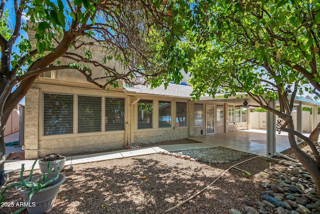 9839 W Utopia Rd, Peoria, AZ 85382 - rear view of property featuring a patio area, stone siding, and roof with shingles