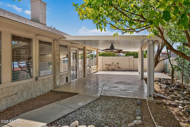 9839 W Utopia Rd, Peoria, AZ 85382 - fenced backyard featuring a ceiling fan and a patio area