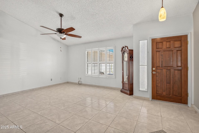 9839 W Utopia Rd, Peoria, AZ 85382 - foyer featuring ceiling fan, a textured ceiling, and light tile patterned flooring