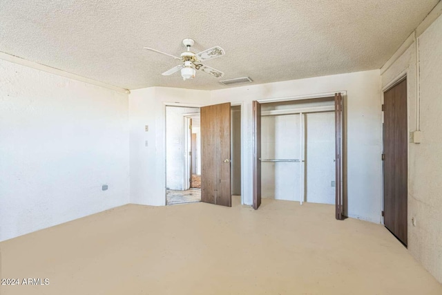 unfurnished bedroom with a textured ceiling and ceiling fan