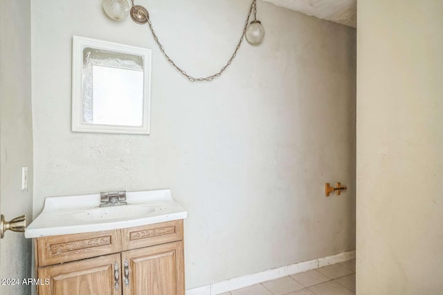 bathroom with tile patterned floors and vanity