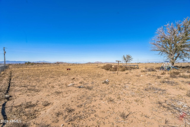 view of yard with a rural view