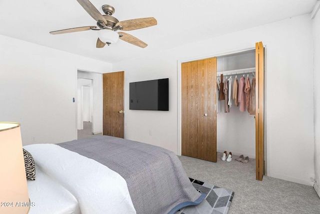 carpeted bedroom featuring ceiling fan and a closet