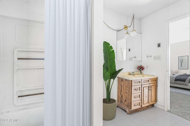 bathroom with tile patterned flooring and vanity