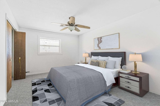 bedroom featuring ceiling fan and carpet floors