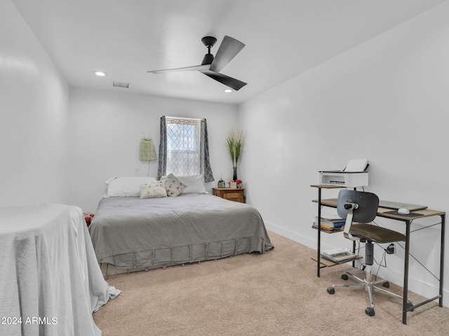 carpeted bedroom with ceiling fan