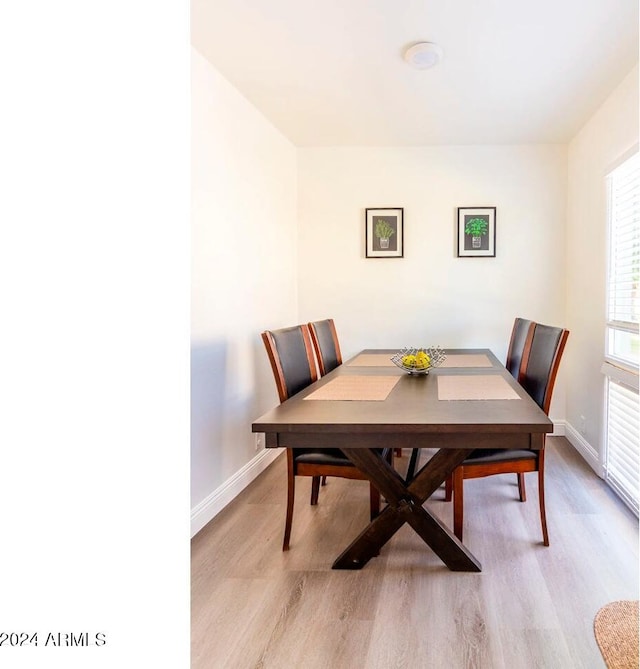 dining space featuring light hardwood / wood-style flooring