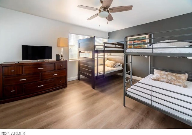 bedroom featuring wood-type flooring and ceiling fan