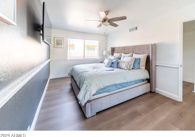 bedroom featuring wood-type flooring and ceiling fan