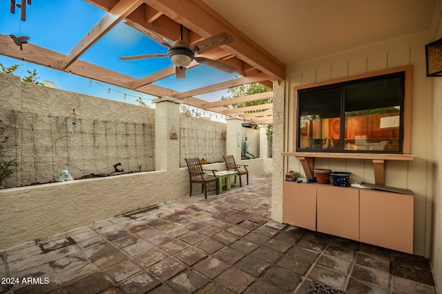 view of patio / terrace with ceiling fan and a pergola